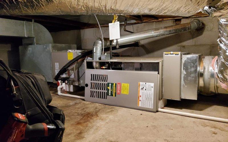 Performed comprehensive tune-up on customer's older furnace system. Conducted electrical testing with readings of 349 on control board components. Inspected heat exchanger, blower assembly, and wiring connections. Replaced thermostat batteries to resolve operational issues and provided information on AC cover options. Customer also has a newer furnace that requires filter replacement, which was noted for follow-up.