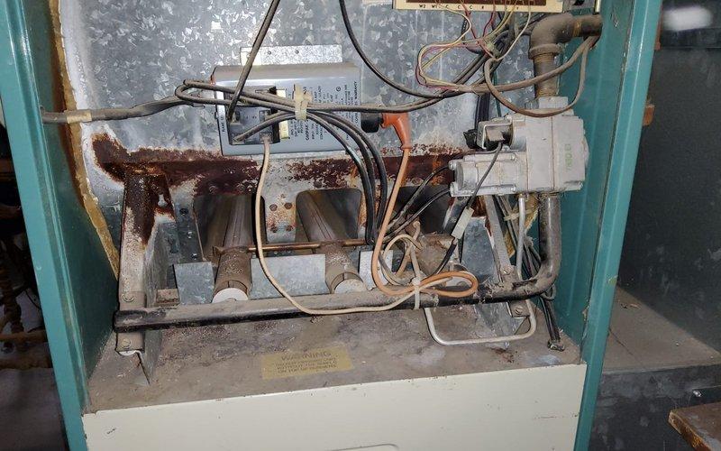 Responded to no-heat call for a 30+ year old Lennox ClimateRiv furnace. Upon inspection, discovered significant corrosion and rust throughout the heat exchanger and internal components. Diagnosed critical failure of the heat exchanger due to age-related deterioration, posing potential safety concerns. Recommended full system replacement due to equipment age and condition.
