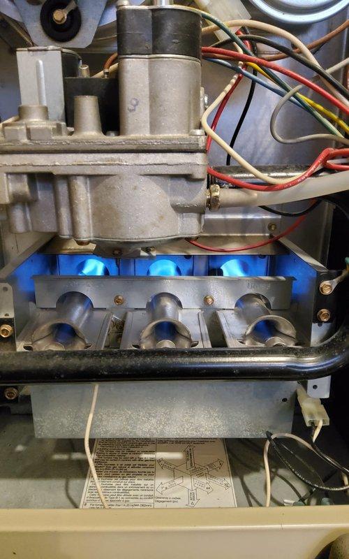 Performed annual heating tune-up on customer's Galaxy steam boiler (Model GXHA-200 EDP). Inspected natural gas burner assembly, confirmed proper flame pattern and combustion with all three burners operating efficiently. Examined gas valve assembly, connection points, and wiring for safety and functionality. System is operating within normal parameters at time of service.