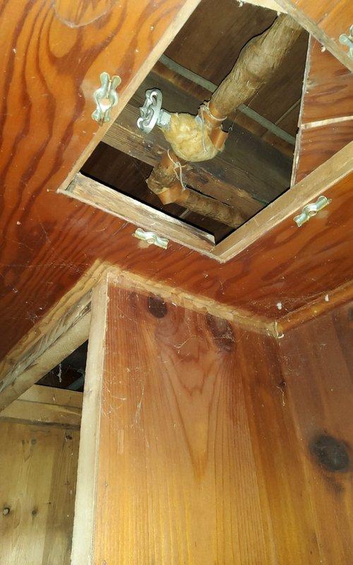 Accessed floor opening to inspect suspected pipe leak in subfloor area. Located and repaired damaged copper pipe joint in ceiling cavity, which showed signs of water damage to surrounding wooden structures. Applied appropriate sealant to connection points to ensure proper seal and prevent future leakage.