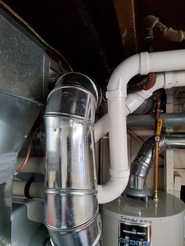 Completed installation of complete HVAC system including new furnace, evaporator coil, condenser, air cleaner, AprilAire humidifier and thermostat. Installed proper venting out the left side with new refrigerant lines. System includes Bradford White water heater with all connections properly secured and tested for optimal performance.