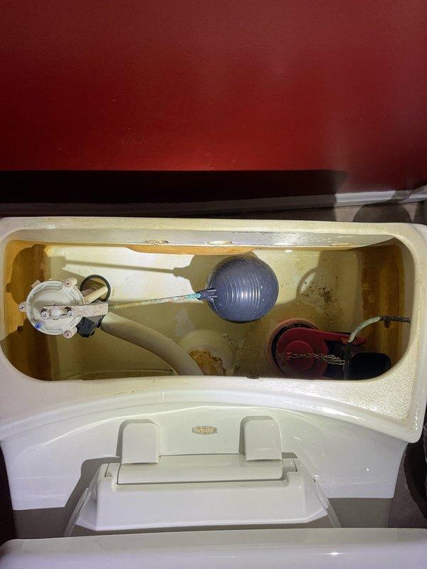 Responded to service call for three toilets requiring replacement. Upon inspection, identified one unit with significant leakage and deteriorated internal components showing mineral buildup and discoloration. Removed old toilets, installed three new units, and verified proper operation with no leaks after installation.