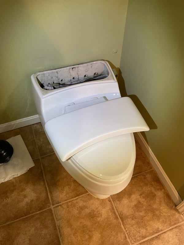 Responded to service call for three toilets requiring replacement. Upon inspection, identified one unit with significant leakage and deteriorated internal components showing mineral buildup and discoloration. Removed old toilets, installed three new units, and verified proper operation with no leaks after installation.