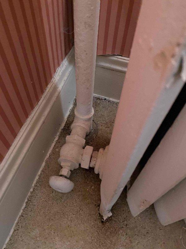Responded to emergency call for elderly customer with no heat and leaking radiator on 2nd floor affecting 1st floor living room. Diagnosed faulty radiator valve causing water leakage. Replaced defective valve, bled radiator system, and verified proper heat distribution throughout home after repair.