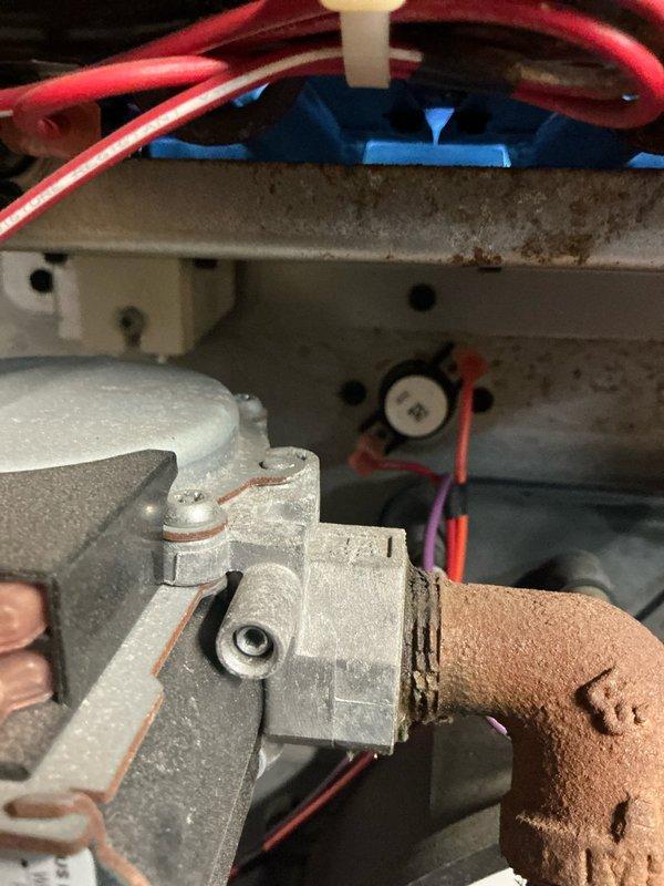 Performed scheduled heating tune-up on residential furnace system. Inspected blower assembly and motor for proper operation, finding normal wear. Examined gas valve and burner assembly connections, noting minor oxidation on copper fitting but confirming proper functionality. System is operating within specifications after service.