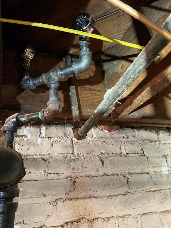 Completed scheduled preventative maintenance on boiler system. Inspected existing plumbing infrastructure including P-trap assembly, galvanized piping, and copper distribution lines. System shows normal wear but remains in functional condition with no immediate repair requirements.