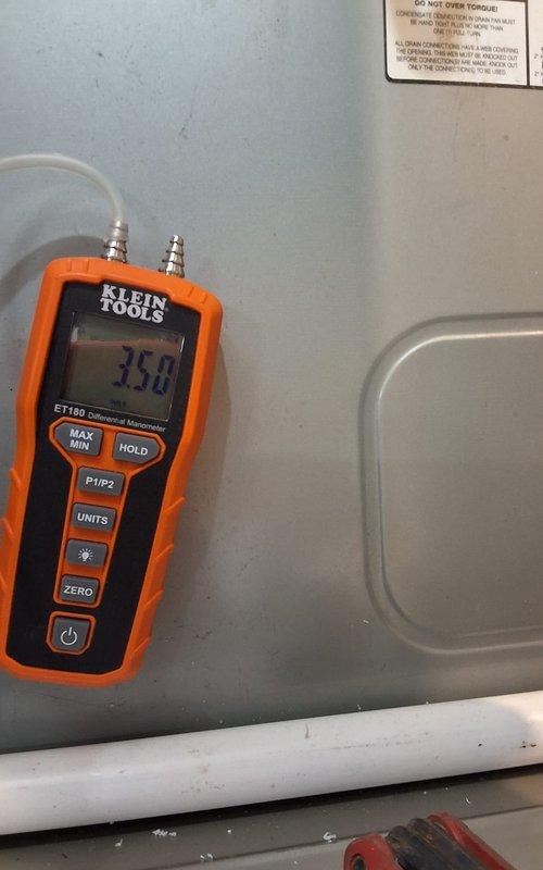 Installed new furnace and thermostat while reusing existing AC system, humidifier, filter, and condensate pump. Maintained compatibility with existing 21" wide furnace space and reused 3" PVC venting. Performed gas pressure testing with manometer, confirming proper readings at 350 WC and 15.0 WC to ensure system operates within manufacturer specifications.