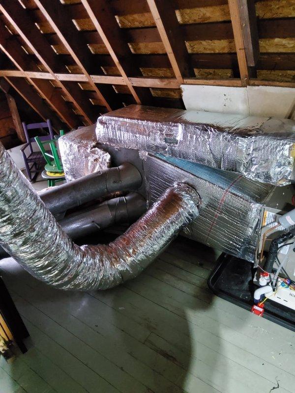Completed warranty replacement of air handler with new gas furnace and evaporator coil. Integrated the new furnace with existing heat pump system, configuring it to function as auxiliary heat source. Installation included proper connection of ductwork, electrical components, and control systems in utility area.