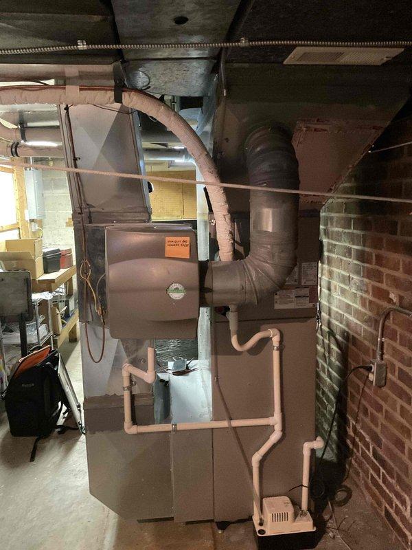 Performed annual heating tune-up on HP furnace per home maintenance plan. Conducted full system inspection with access panel open, testing electrical components with multimeter and checking airflow parameters. All connections, ductwork, and PVC drainage/ventilation system functioning properly; system is operating within manufacturer specifications.
