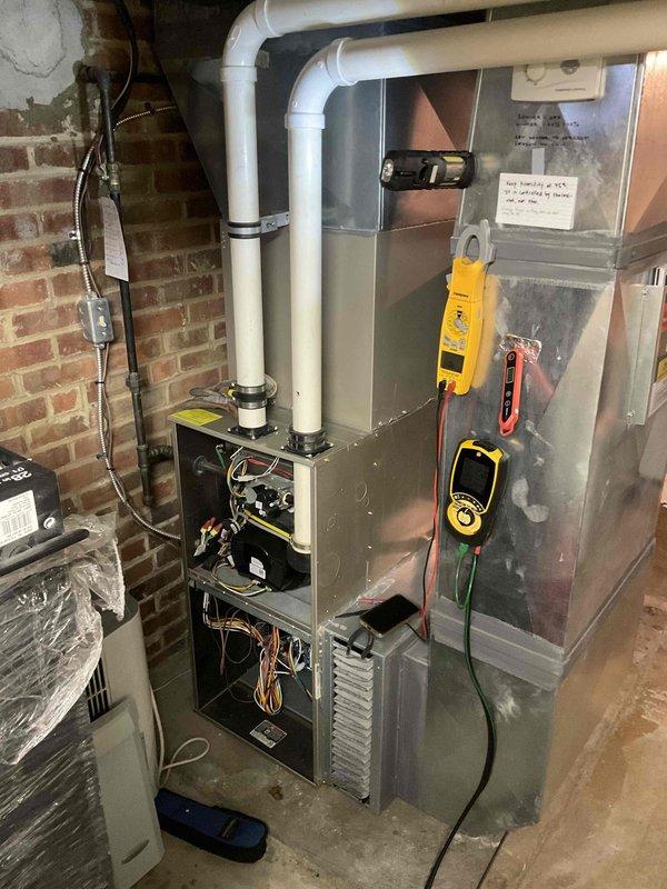 Performed annual heating tune-up on HP furnace per home maintenance plan. Conducted full system inspection with access panel open, testing electrical components with multimeter and checking airflow parameters. All connections, ductwork, and PVC drainage/ventilation system functioning properly; system is operating within manufacturer specifications.