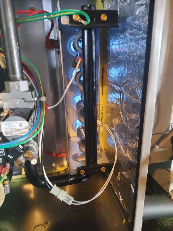 Responded to service call for furnace with burning plastic smell. Upon inspection of heat exchanger and internal components, found damaged plastic connector causing the burning odor. Replaced faulty wiring connector and verified proper operation of all electrical connections. System now functioning normally with no unusual odors during operation.
