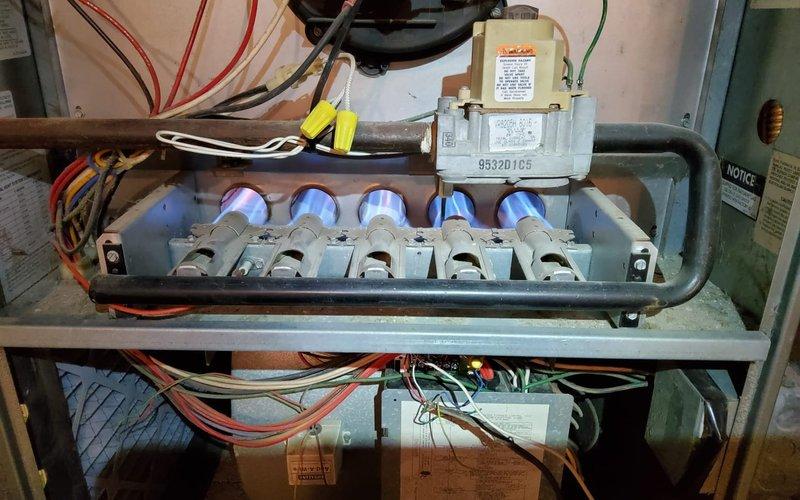 Replaced faulty control board in furnace that was preventing heating operation. Upon installation of new board, verified proper ignition sequence with all five burners lighting with strong blue flame. System now cycling correctly and providing heat as designed.