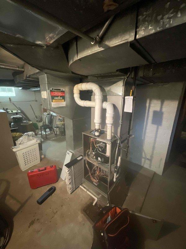 Performed routine maintenance on 4-year-old MVP furnace system. Inspected all internal components with front panel removed, examined PVC venting system, and checked connections to ductwork. System is functioning properly with no issues detected.