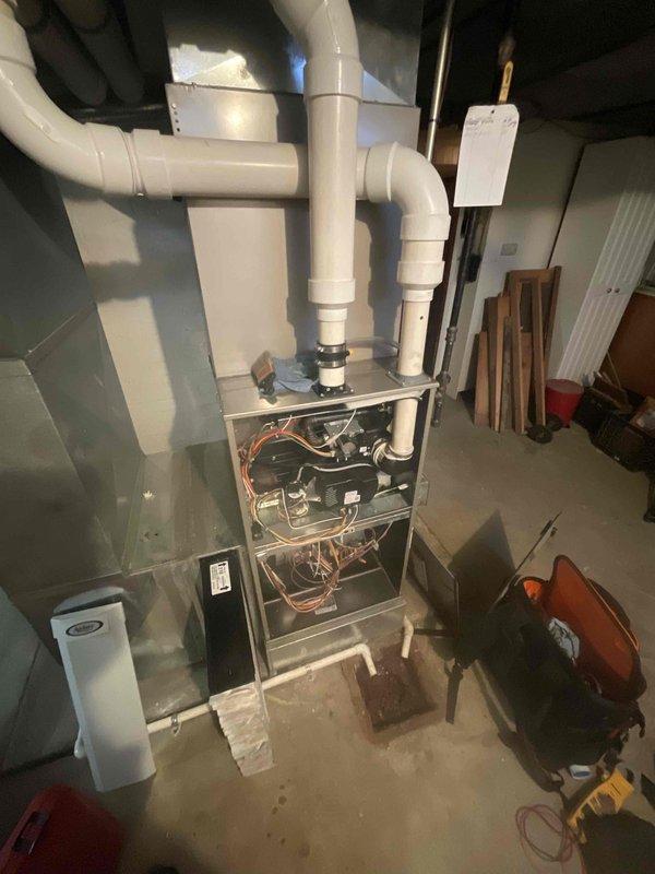 Performed routine maintenance on 4-year-old MVP furnace system. Inspected all internal components with front panel removed, examined PVC venting system, and checked connections to ductwork. System is functioning properly with no issues detected.