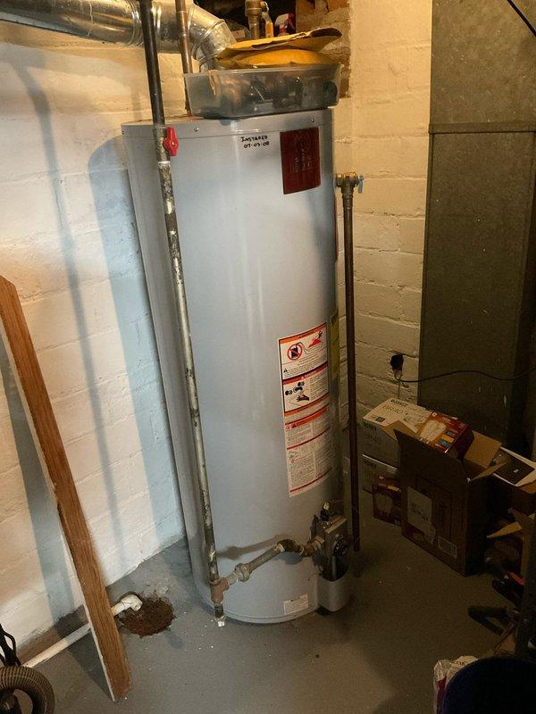 Responded to service call for non-functional water heater with suspected ignition issues. Upon inspection of the tanked water heater installed in basement utility room, diagnosed and repaired faulty ignition system. Unit is now operational with all connections verified and system tested for proper function.