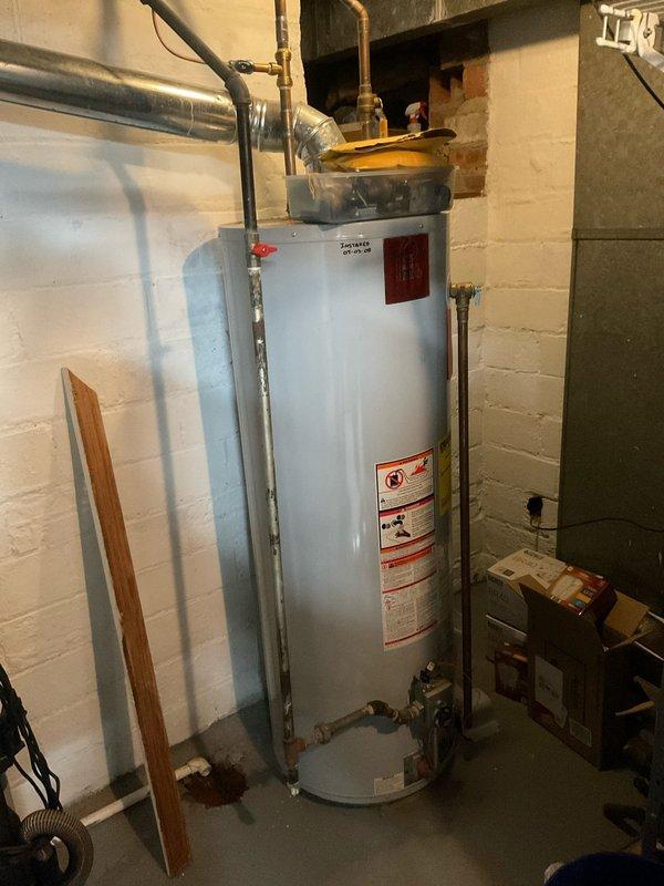 Responded to service call for non-functional water heater with suspected ignition issues. Upon inspection of the tanked water heater installed in basement utility room, diagnosed and repaired faulty ignition system. Unit is now operational with all connections verified and system tested for proper function.
