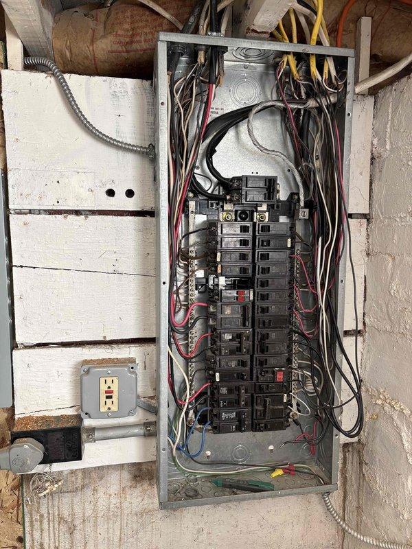 Conducted furnace replacement estimate for aging HVAC system located in basement utility area. Inspected existing Aprilaire humidifier system, ductwork configuration, and electrical service panel to determine compatibility requirements for new equipment. Documented current installation conditions to provide accurate replacement options.