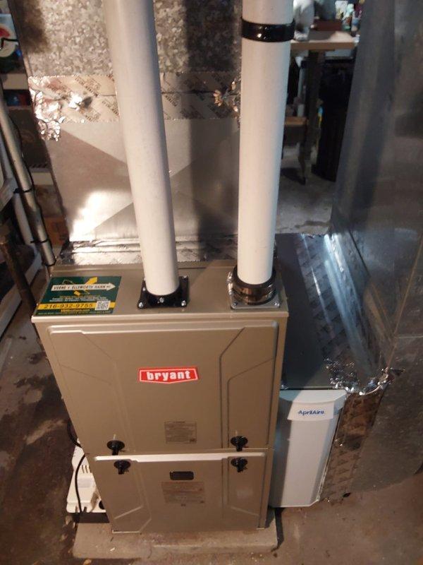 Completed installation of new Bryant furnace with PVC venting routed through right side of home. Installed new air cleaner to replace outdated 2200 SpaceGard unit, using model 1210 to minimize duct modifications. Added ozone-free air scrubber to improve indoor air quality as requested.