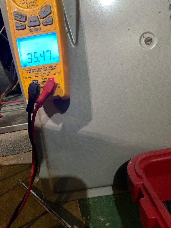 Performed furnace tune-up and preventative maintenance service. Conducted electrical diagnostics with multimeter showing 35.47V reading and verified heat exchanger temperature at 68.2°C, confirming system is operating within normal parameters.