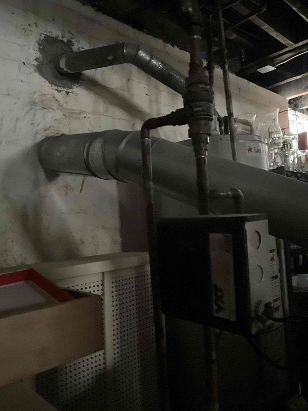 Performed diagnostic assessment on 15-year-old steam boiler system that was actively steaming. Inspected insulated piping network and connection points showing signs of wear and moisture damage. Determined thermostat replacement was required after previous unsuccessful attempt by handyman. Successfully installed compatible replacement thermostat and verified proper system operation.