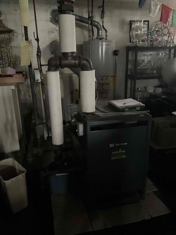 Performed diagnostic assessment on 15-year-old steam boiler system that was actively steaming. Inspected insulated piping network and connection points showing signs of wear and moisture damage. Determined thermostat replacement was required after previous unsuccessful attempt by handyman. Successfully installed compatible replacement thermostat and verified proper system operation.