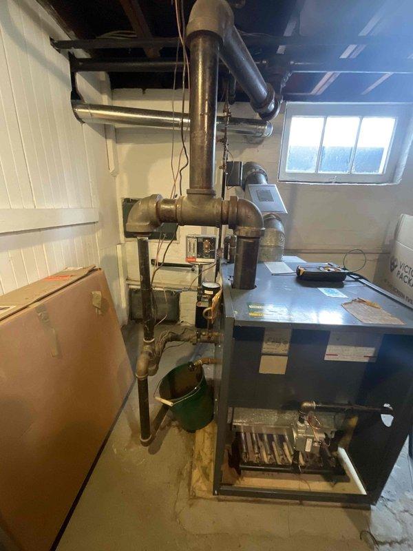 Performed annual steam boiler maintenance service, including inspection and testing of the burner assembly. Observed proper flame pattern and combustion in the heat exchanger ports. System is currently operational with no immediate issues requiring repair.