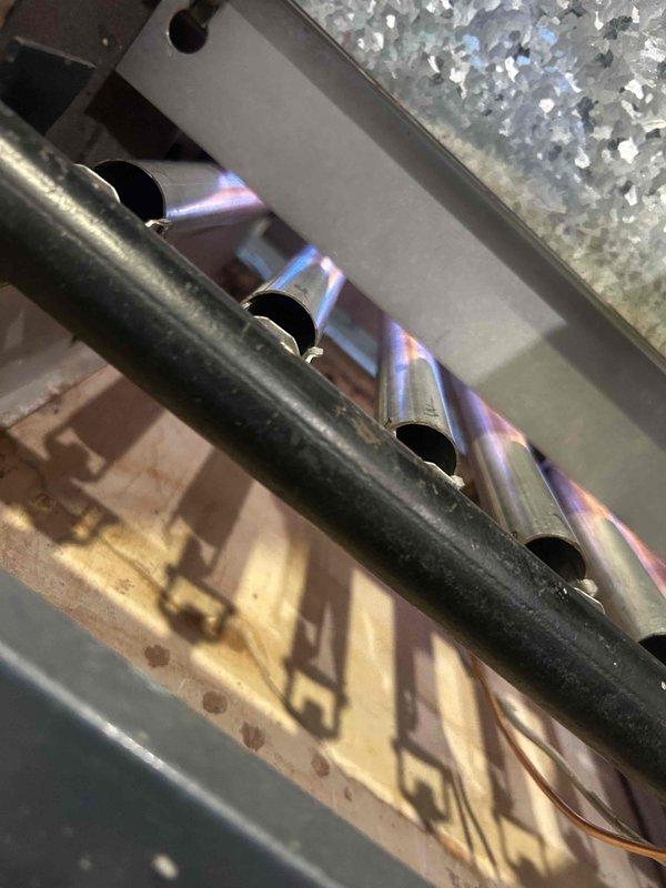 Performed annual steam boiler maintenance service, including inspection and testing of the burner assembly. Observed proper flame pattern and combustion in the heat exchanger ports. System is currently operational with no immediate issues requiring repair.
