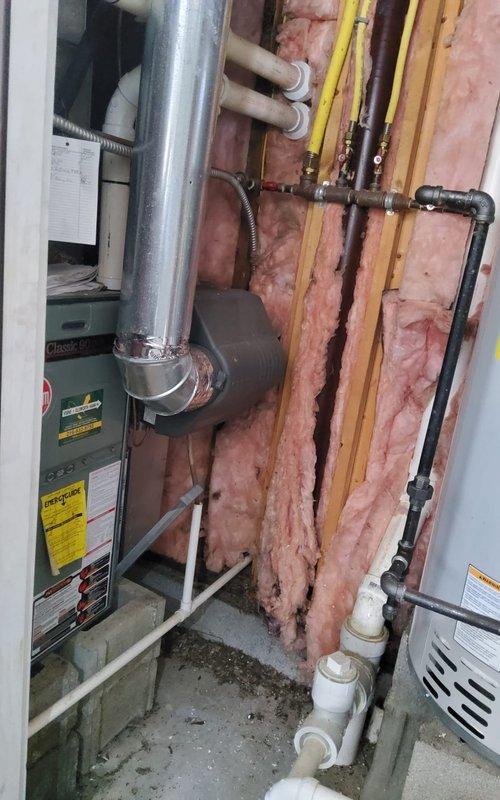 Responded to no heat call for 20-year-old furnace. Diagnosed failed inducer motor causing system lockout. Installed replacement inducer assembly and verified proper venting through PVC exhaust. System now operating within normal parameters with restored heat output.