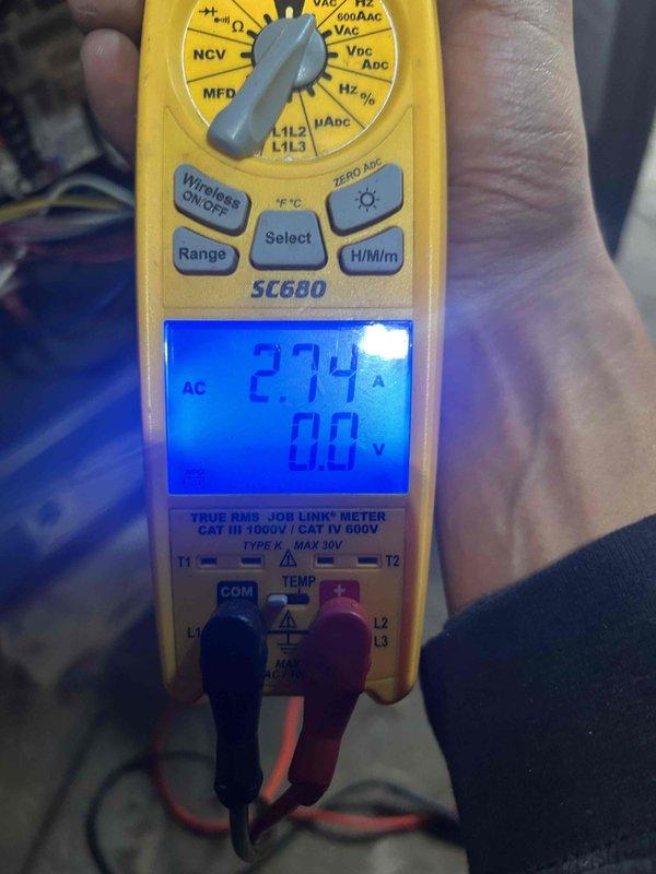 Performed scheduled heating tune-up on residential furnace. Conducted electrical testing with multimeter showing 27.4 amps and verified proper operation of the system. Inspected internal components with front panel removed including wiring, circuit boards, and exhaust/intake piping.