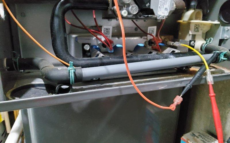 Responded to no heat call on 9-year-old furnace. Diagnosed faulty flame sensor showing corrosion at connection point. Removed, cleaned, and reinstalled the sensor, restoring proper flame detection. System now functioning normally with heat production verified.