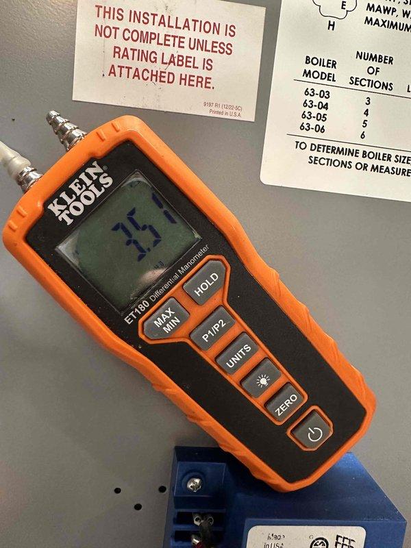 Successfully completed steam boiler replacement, installing a new unit with proper venting system and pipe connections. Verified installation with temperature readings using Klein Tools ET100 Digital Thermometer and confirmed system functionality with temperature at 15 degrees.