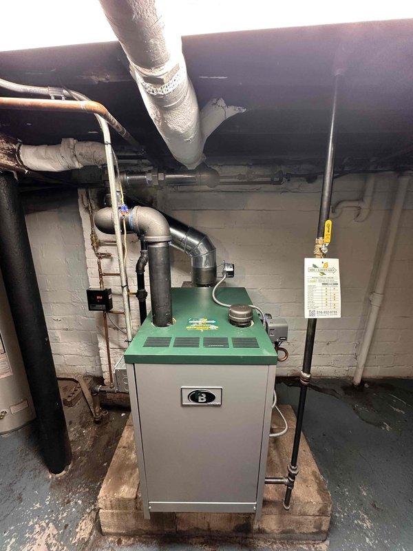 Successfully completed steam boiler replacement, installing a new unit with proper venting system and pipe connections. Verified installation with temperature readings using Klein Tools ET100 Digital Thermometer and confirmed system functionality with temperature at 15 degrees.