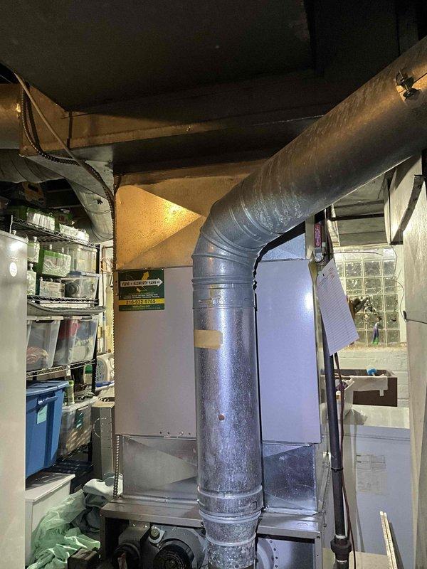 Performed diagnostic assessment of 15-year-old furnace system showing significant deterioration. Inspection revealed worn ductwork connections and aging control components including Honeywell thermostat panel. Recommended full system replacement due to unit age, declining efficiency, and potential safety concerns.