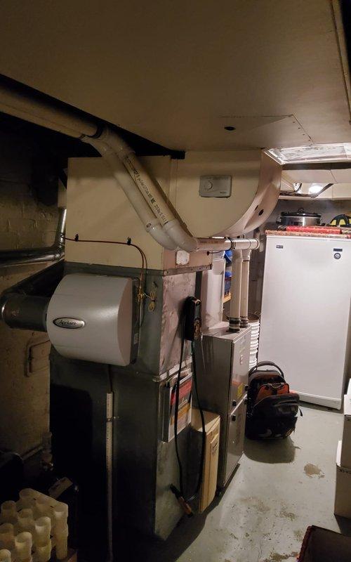 Completed scheduled heating maintenance service on two HVAC systems located in basement utility room. Performed comprehensive inspection and maintenance of primary furnace unit with attached Aprilaire humidifier and secondary heating system. All components functioning properly with no issues detected; systems ready for heating season operation.