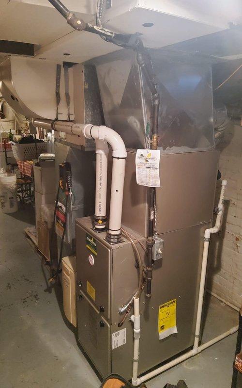 Completed scheduled heating maintenance service on two HVAC systems located in basement utility room. Performed comprehensive inspection and maintenance of primary furnace unit with attached Aprilaire humidifier and secondary heating system. All components functioning properly with no issues detected; systems ready for heating season operation.