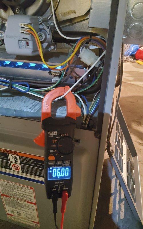Performed diagnostic testing on furnace unit that was exhibiting buzzing/rattling noise and shutting off unexpectedly. Conducted electrical measurements using clamp meter on control components and wiring. Testing revealed abnormal current readings, consistent with the previously identified capacitor issues. Verified proper system operation after previous capacitor replacement.