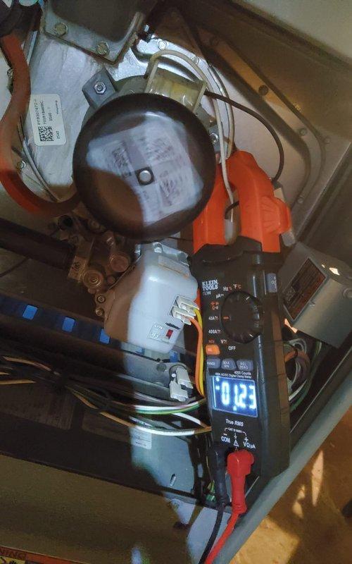 Performed diagnostic testing on furnace unit that was exhibiting buzzing/rattling noise and shutting off unexpectedly. Conducted electrical measurements using clamp meter on control components and wiring. Testing revealed abnormal current readings, consistent with the previously identified capacitor issues. Verified proper system operation after previous capacitor replacement.