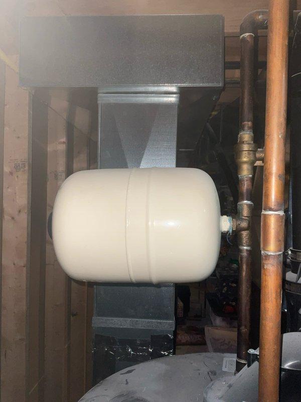 Conducted service call to assess customer's water heater replacement needs. Inspected existing Rheem tank water heater located in basement utility room, noting connections to copper supply lines, PVC drainage, and black vent piping. Also examined expansion tank mounted on HVAC equipment. Provided customer with replacement options and installation estimate as requested.