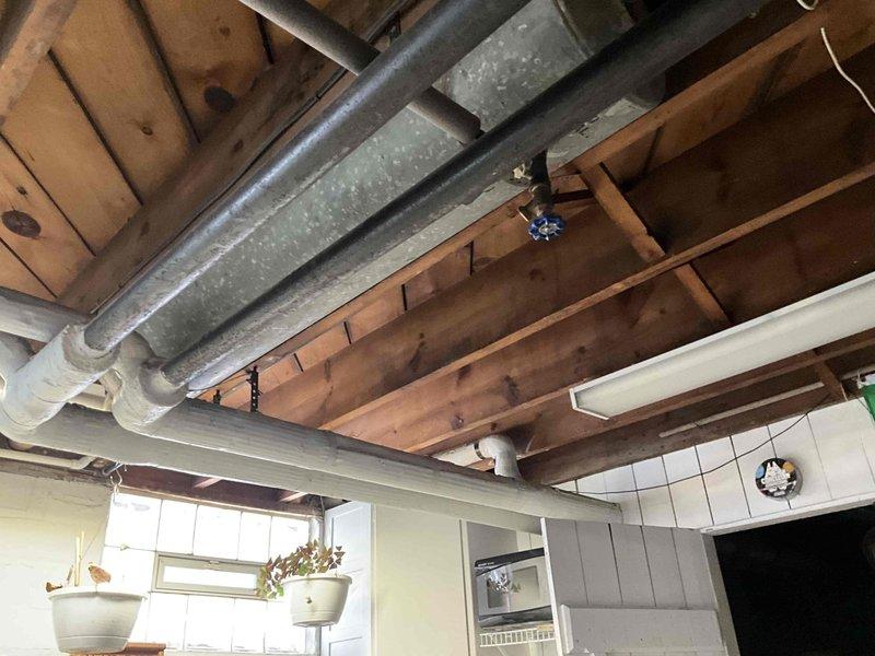 Conducted boiler replacement estimate for a Weil McLain system, sizing at 133,000 BTU. Inspected existing mechanical room configuration with current boiler unit and associated piping network. Documented ceiling clearances and ductwork to ensure proper installation parameters for the new system.