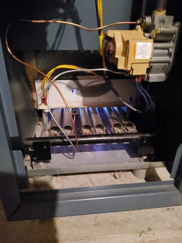 Performed scheduled Home Plan Heating Tune Up on system. Inspected gas valve assembly and verified proper flame pattern with consistent blue flames across all burner tubes. Examined heat exchanger fins and found normal oxidation with no significant blockages or structural concerns.