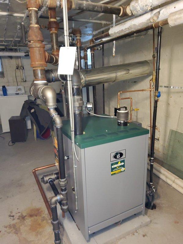 Successfully completed installation of new steam gas boiler system with all required components including backflow preventer, auto feeder, and White-Rodgers digital thermostat. Replaced 14 radiator vents (excluding master bathroom due to cracked radiator), 3 main line steam vents near boiler, radiator valve in small bedroom, and Hartford loop with appropriate 3" black pipe connections.