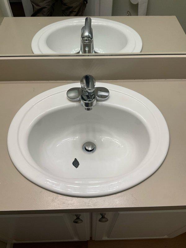 Successfully installed two customer-supplied sinks with accompanying faucet fixtures in bathroom vanities. Both installations featured white porcelain sinks with chrome single-handle faucets mounted on light-colored countertops, all verified to be properly functioning with no leaks.