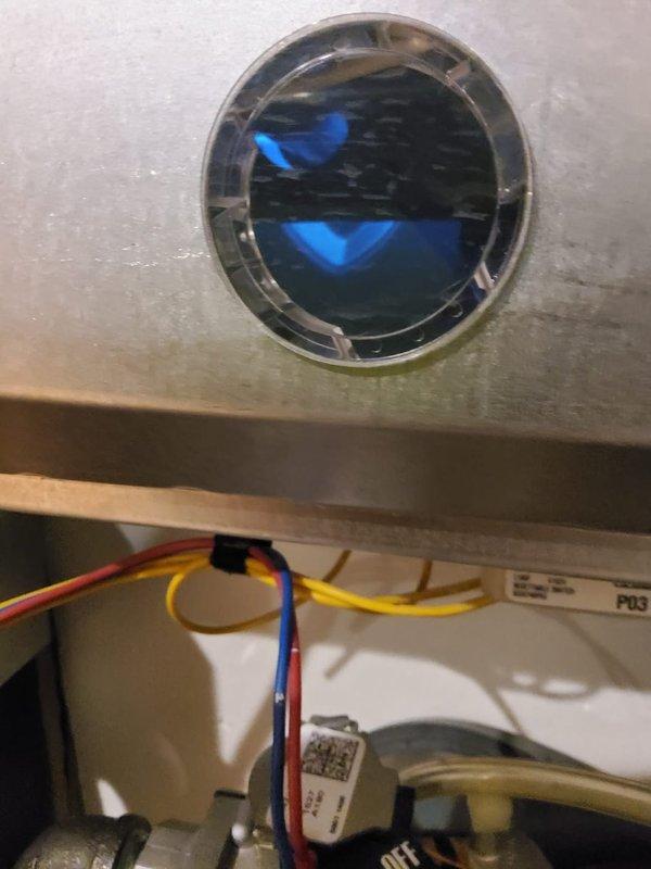 Performed routine maintenance on 16-year-old and 10-year-old heating furnaces per home plan agreement. Inspected flame sensor and sight glass for proper burner operation, confirming normal blue flame pattern. Checked and verified proper operation of ignition system and control board connections.