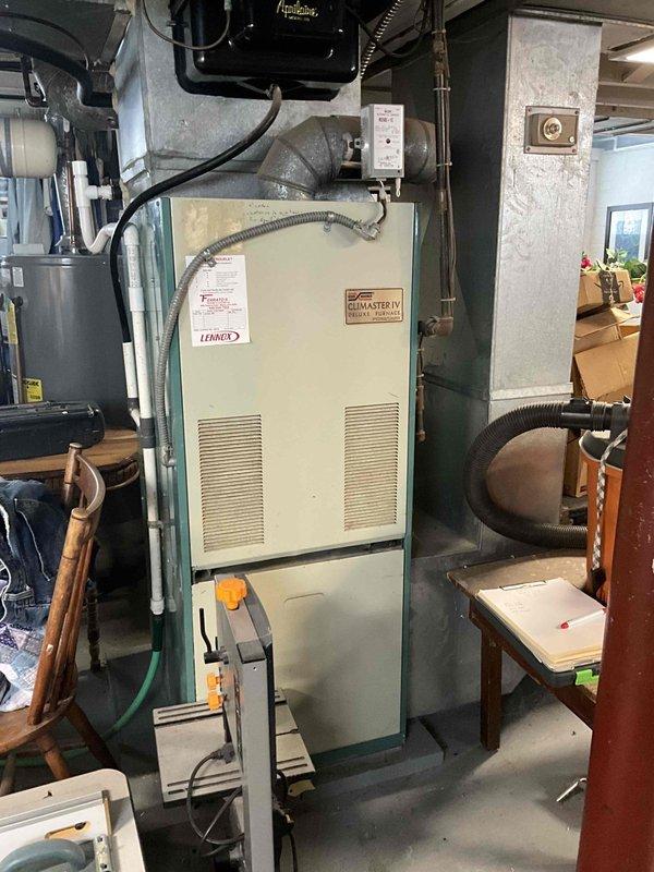 Performed diagnostic assessment on 30+ year old non-functional heating system. Identified end-of-life equipment with Climate IV brand furnace showing significant deterioration. Recommended full system replacement due to age, condition, and lack of heat production. Customer was advised of replacement options that would restore reliable heating functionality.