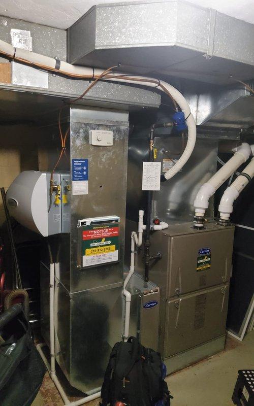 Performed scheduled heating maintenance on 6-year-old Carrier furnace under Home Plan agreement. Inspected burner assembly and verified proper ignition with blue flame pattern. Examined electrical connections, control board, and gas valve for proper operation. System functioning normally with no issues identified.