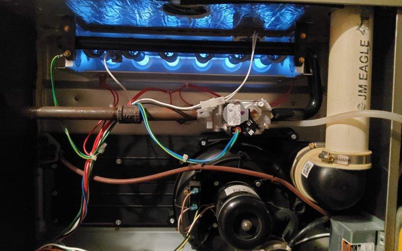 Performed scheduled heating maintenance on 6-year-old Carrier furnace under Home Plan agreement. Inspected burner assembly and verified proper ignition with blue flame pattern. Examined electrical connections, control board, and gas valve for proper operation. System functioning normally with no issues identified.