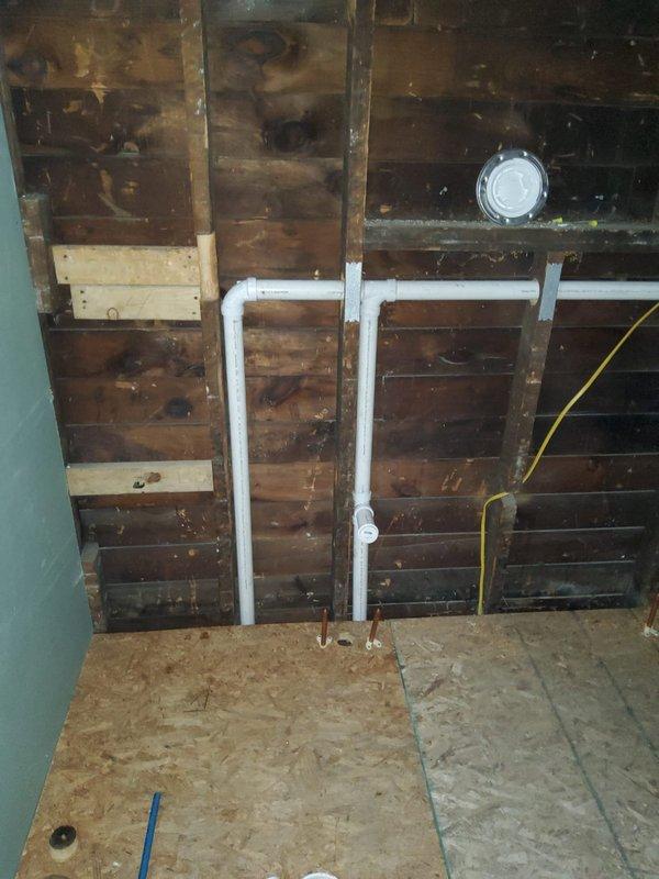 Completed stack replacement in interior wall cavity per estimate. Installed new vertical PVC drainage pipes with proper fittings, connecting to existing copper lines at base. Work included opening wall access, removing old stack, installing new components, and preparing area for subsequent drywall installation.