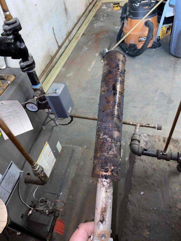 Responded to no-heat call for aging system (10+ years). Discovered severe corrosion and deterioration on critical pipe section that compromised system integrity. Removed damaged component, installed new replacement part, and verified proper system operation after repair.