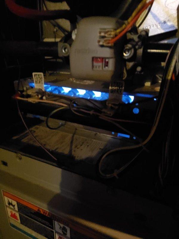 Responded to service call for non-functioning furnace causing cold home conditions. Upon inspection, found furnace operational with proper flame ignition and burner function as evidenced by characteristic blue flame. Performed visual inspection of blower motor, wiring connections, and control components; all systems verified working correctly. No issues identified; system now heating home adequately.