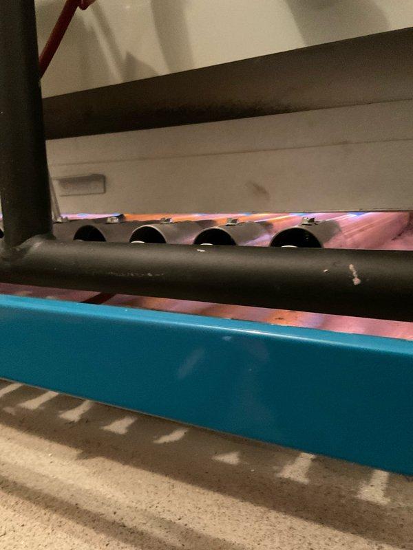 Performed annual maintenance and tune-up on 2-year-old furnace system. Inspected burner assembly for proper ignition and flame pattern, confirming normal operation with consistent blue flame across all four burners. Examined copper gas line connections and valve assembly, noting no leaks or corrosion issues. System functioning correctly with all components in good working condition.